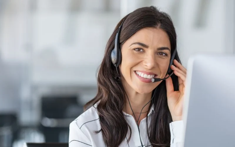 a-lady-appointment-setter-holding-her-hand-on-headphones