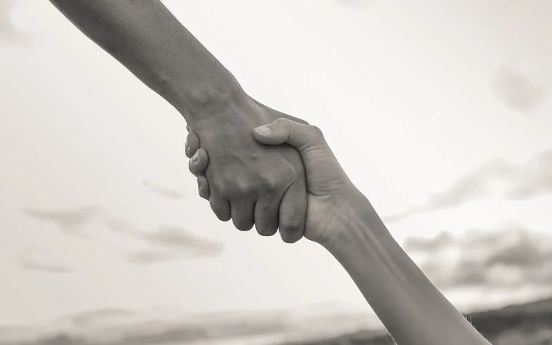 a-photo-of-two-people-holding-hands