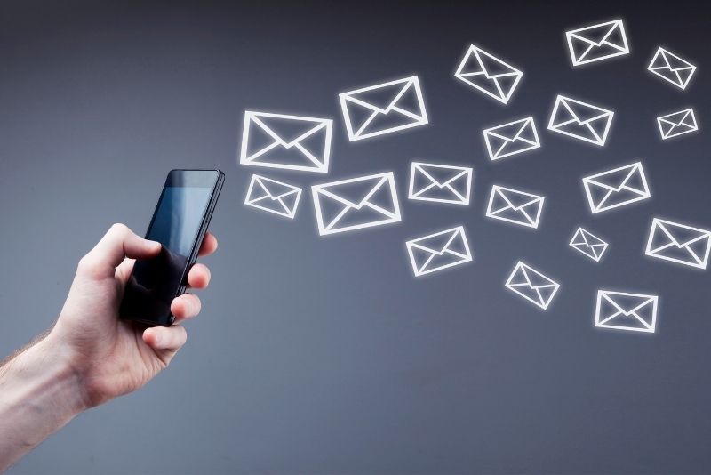 a-mobile-in-hand-and-message-icons-arround