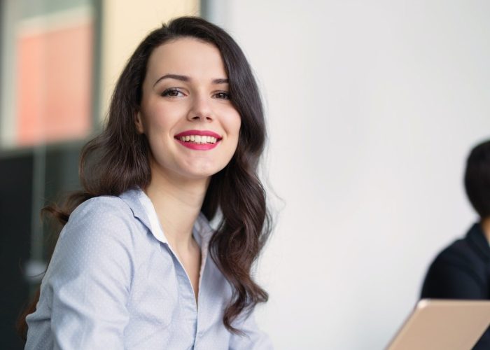 beautiful-businesswoman-using-tablet-to-gather-information-in-of-e1625114402155.jpg a-appointment-setter-using-tablet-to-gather-information